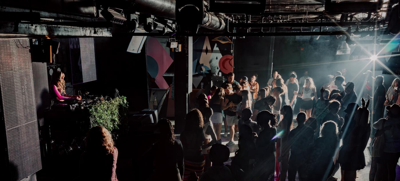 The room in full flow, DJ booth to dance floor